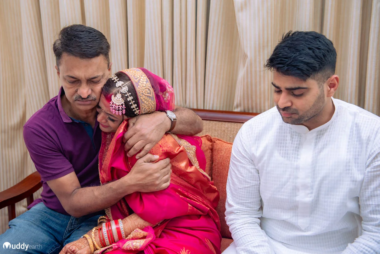 Bollywood style emotional wedding image – candid family moment.