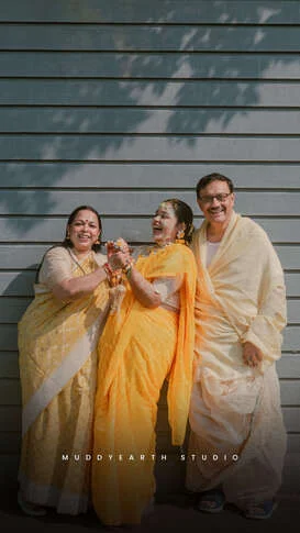 Family enjoying traditional haldi ceremony in Kolkata