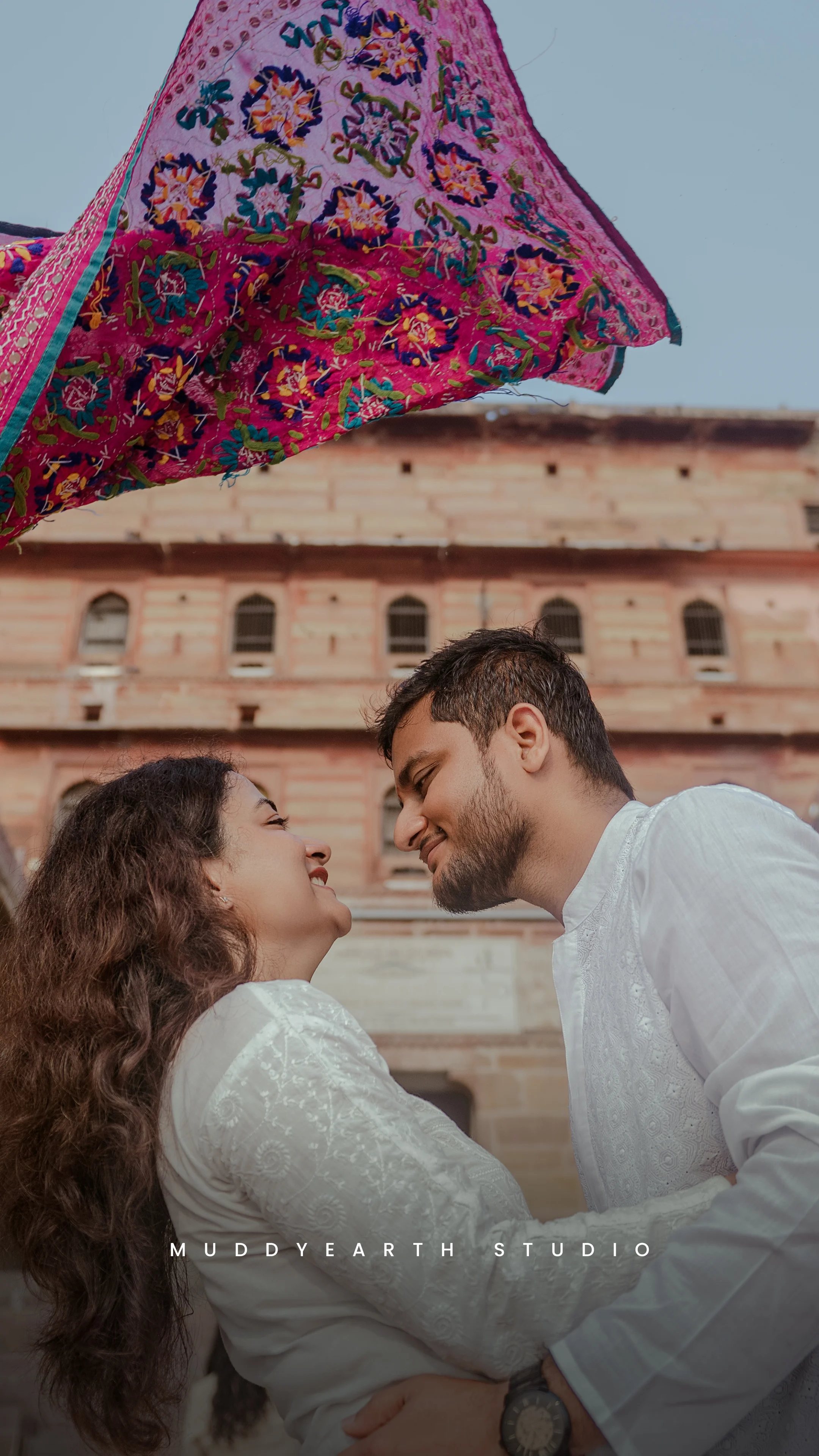 Bride and groom performing sacred wedding pheras